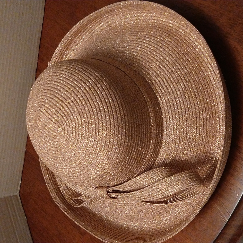 NWOT. Tuscany gold glitter hat with double bow on side. Large rim.